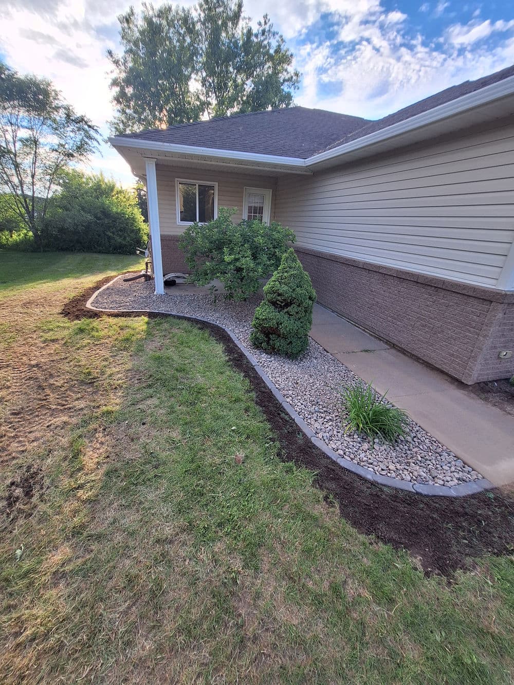 Gallery photos for Concrete Landscape Edging and Rock Bed Installation in Fall Creek: Image #2
