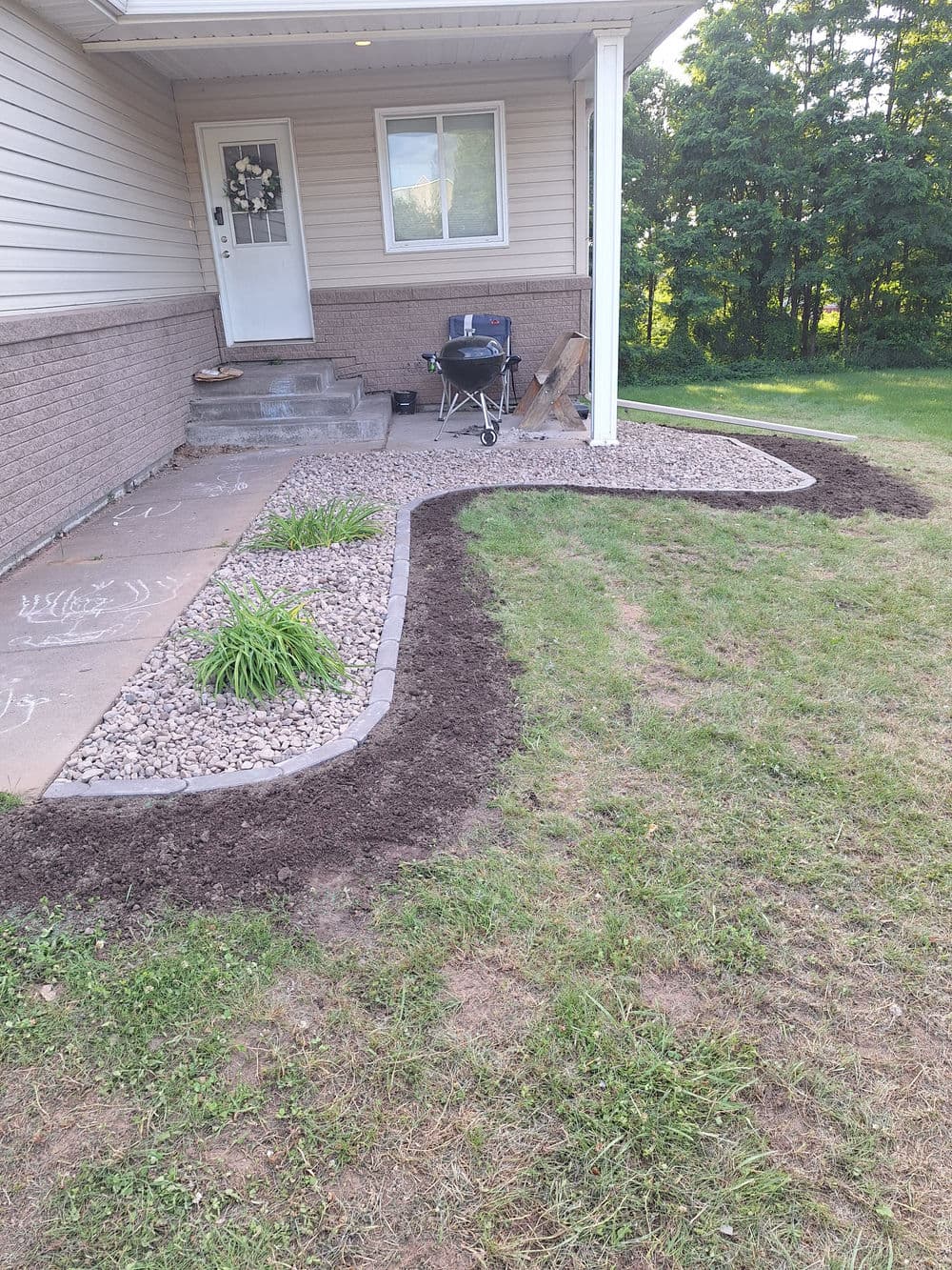 Gallery photos for Concrete Landscape Edging and Rock Bed Installation in Fall Creek: Image #7